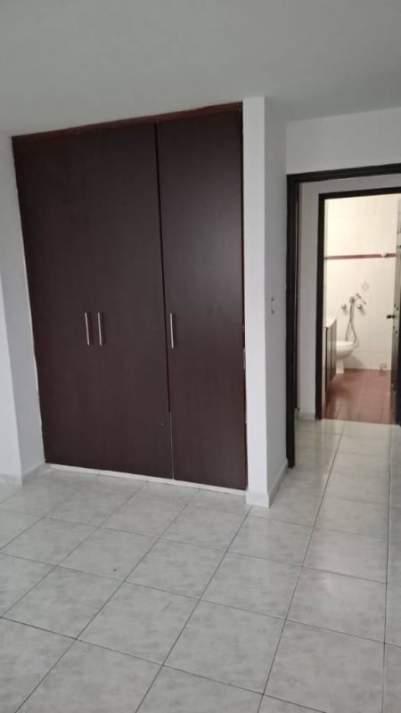 Modern empty living room with AC unit, ceramic flooring and city views at PH Mirasol Punta Paitilla Panama