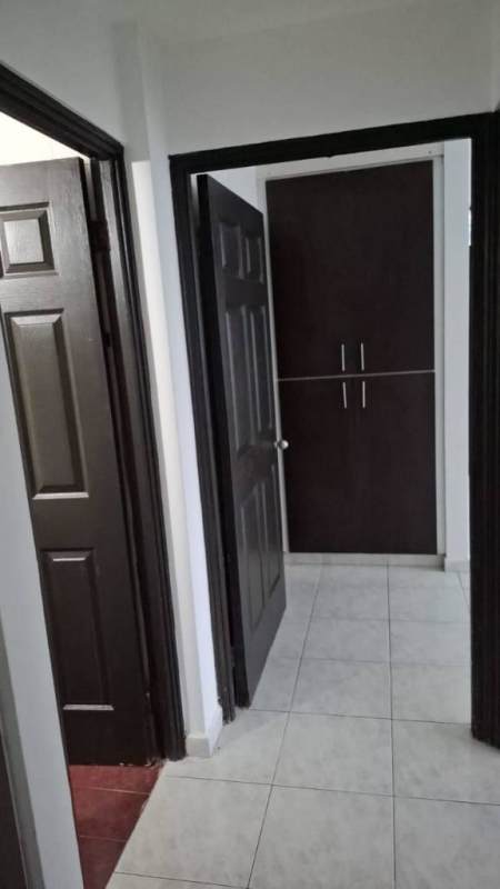 Kitchen view with stainless sink, dark cabinetry, white countertop PH Mirasol Punta Paitilla Panama