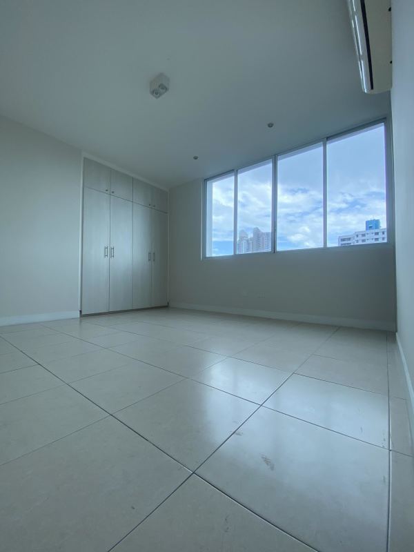Spacious living-dining area with balcony access and skyline views El Cangrejo Panama