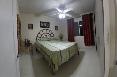 Modern kitchen with granite countertops cabinets in house Gran Reserva Montelimar Costa Verde Panama