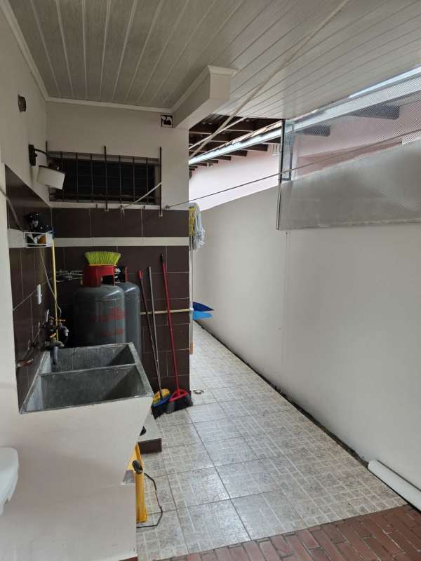 Modern spacious living and dining room with neutral tiles and large windows park Lefevre house Panama