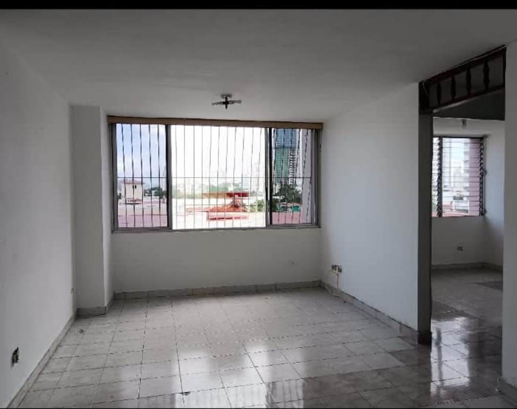 Living dining room leading into compact kitchen PH Vista Hermosa Panama