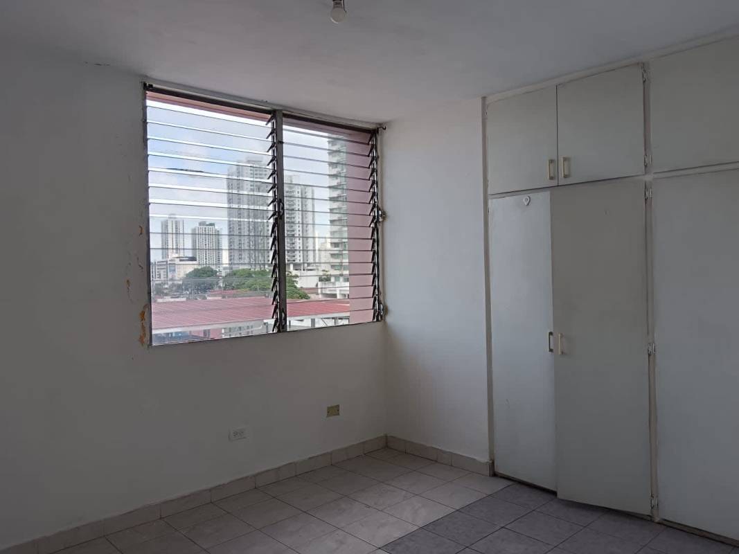 Second bedroom with built-in storage, tiled floor, window PH Vista Hermosa apartment Panama City