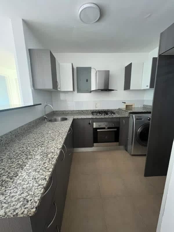 Modern kitchen with granite countertops, gray cabinetry in PH Carrasquilla Park Panama City