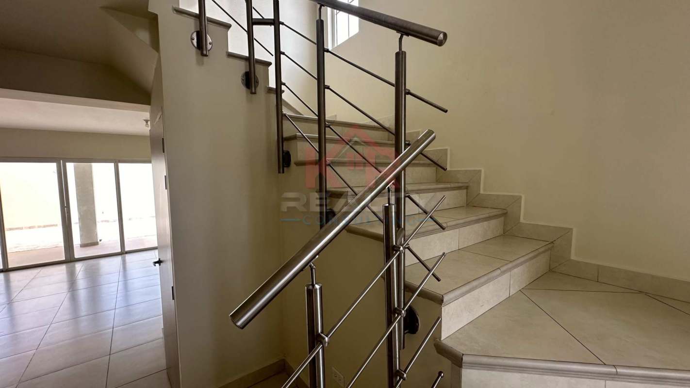 Empty bedroom with tiled floor and large window in Reserva de Versalles