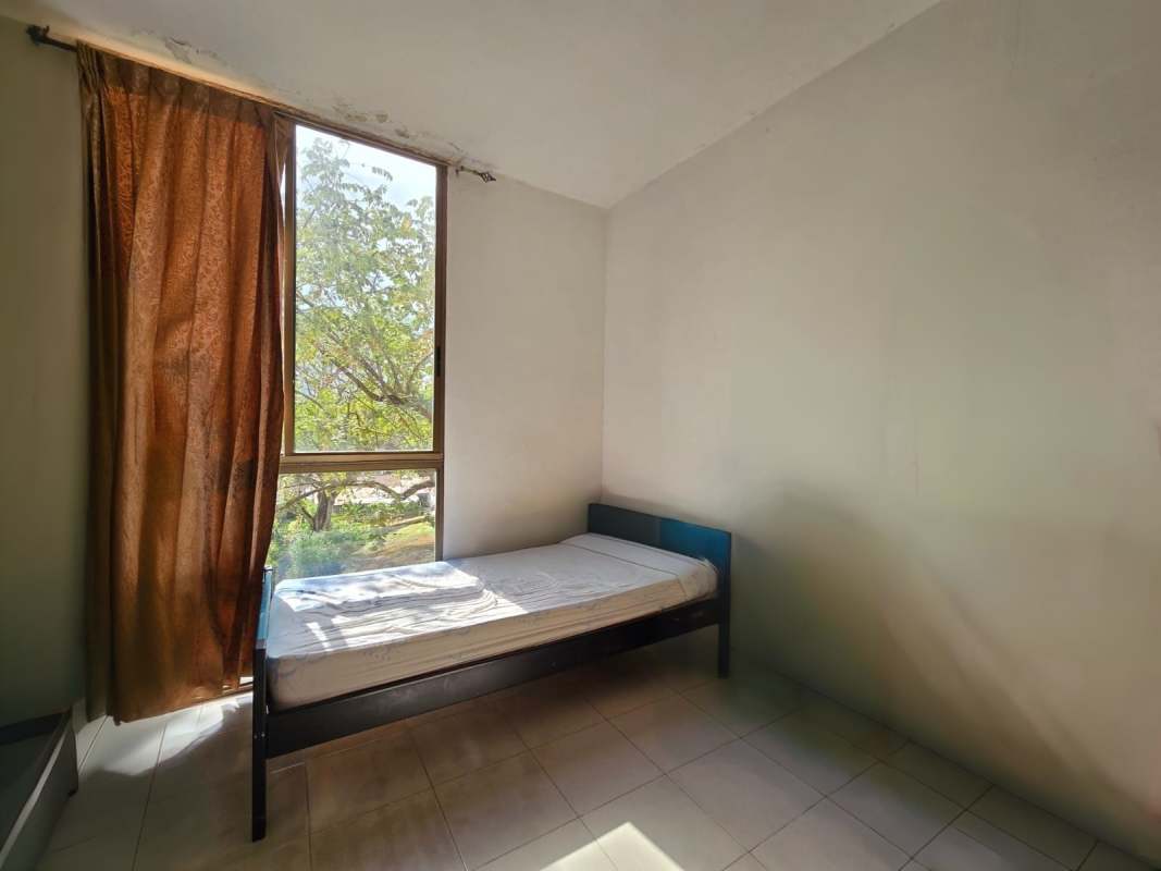 Empty bedroom well lit with tiled floors at PH Parque Miraflores Betania Panama