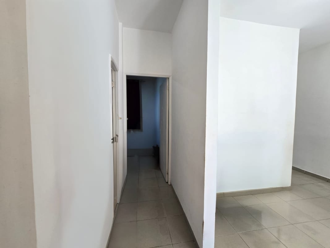 Interior hallway with tile flooring connecting rooms at PH Parque Miraflores Panama City