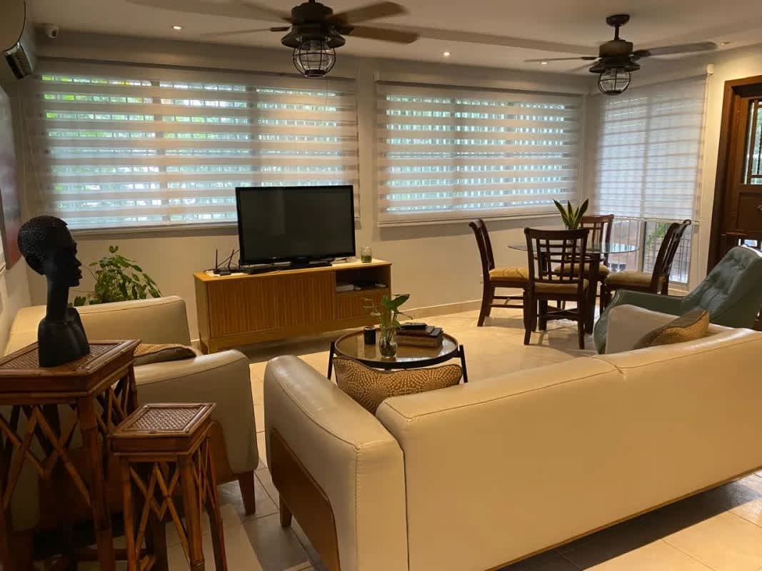 Spacious living room with large windows and tiled floors in house Condado del Rey Panama