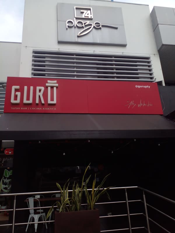 Exterior view of Plaza 74 with signage and restaurant storefront in San Francisco Panama