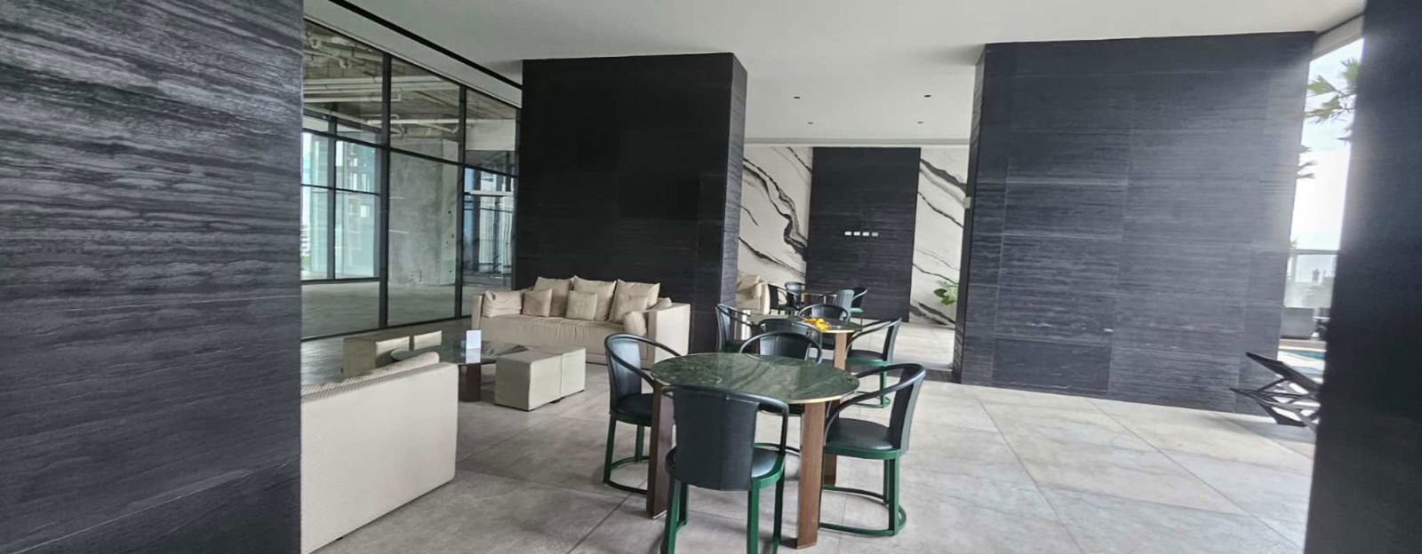 Bathroom with glass shower, marble tile and modern fixtures PH Nuovo Bella Vista Panama