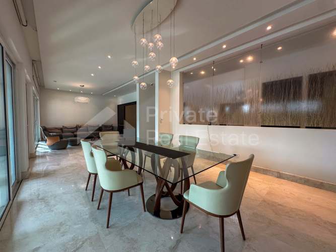 Modern gourmet kitchen with island granite countertops built-in appliances in Costa Las Perlas Panama