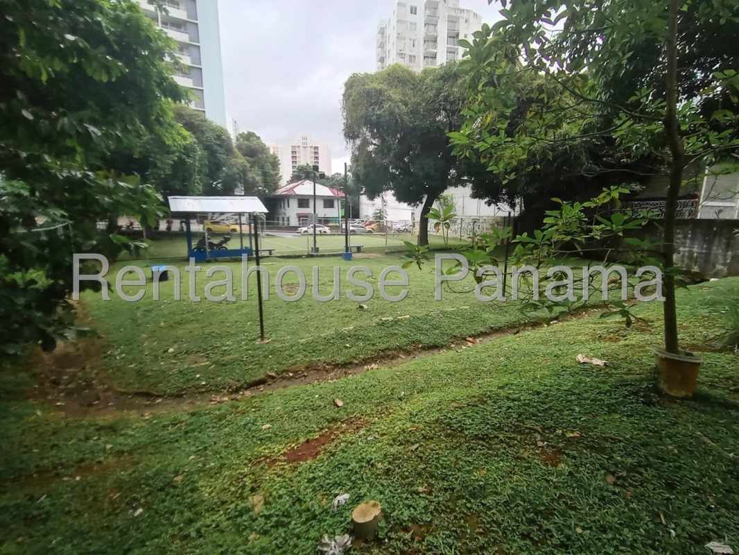 Outdoor garden with exercise equipment surrounded by high-rise buildings Carrasquilla Panama