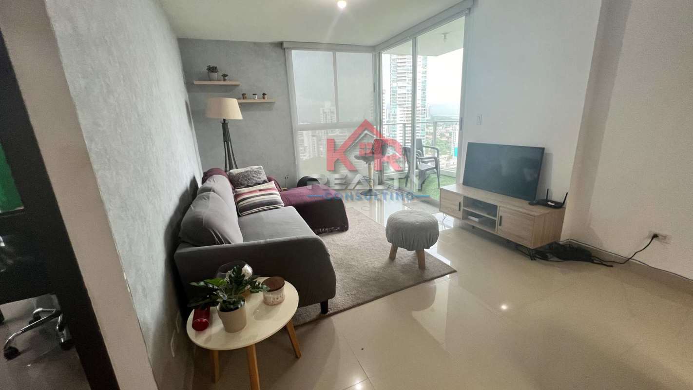 Skyline view rooftop pool with jacuzzi and lounging area PH Residencias del Sol Panama