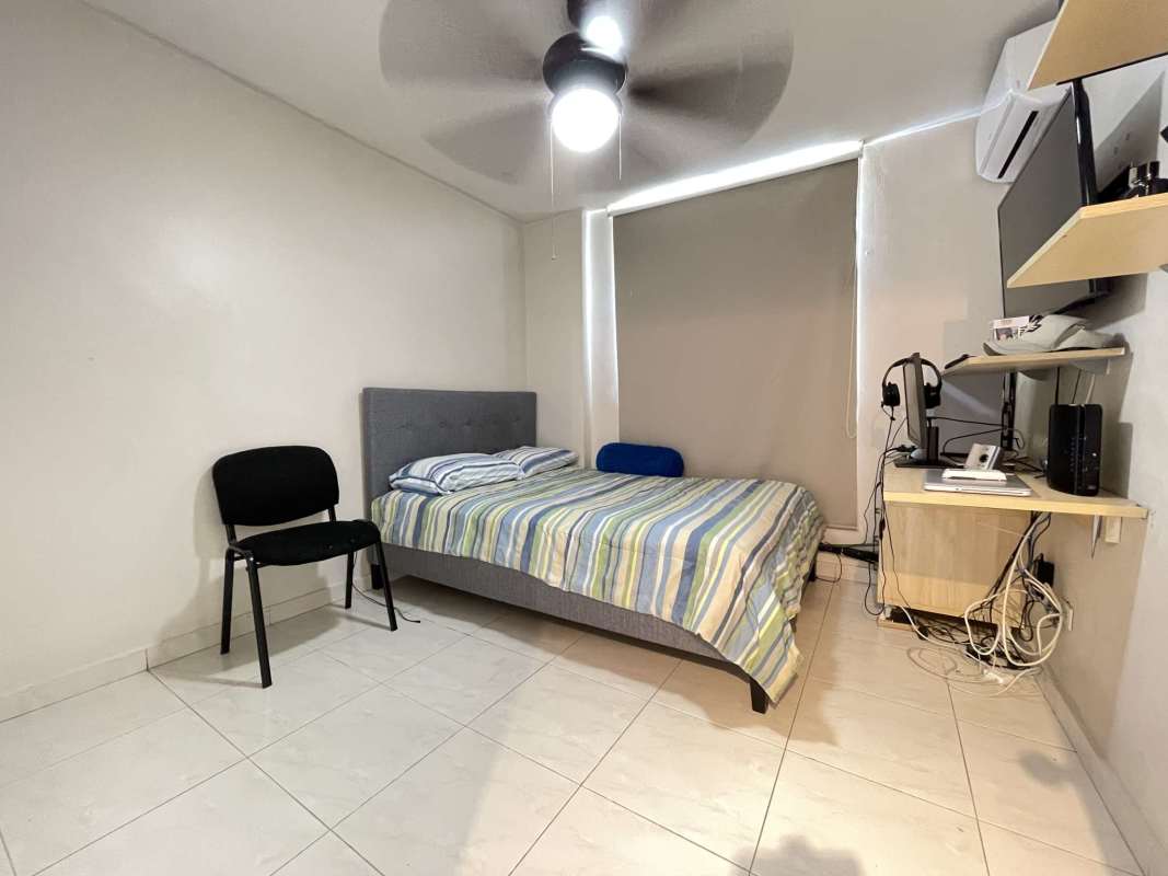 Bright bedroom with built-in closet ceiling fan and window PH McGregor Hill Condado del Rey