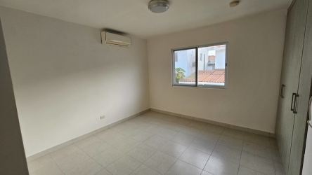 Spacious living area with tile flooring, split AC, stairs, and garden access PH Versalles