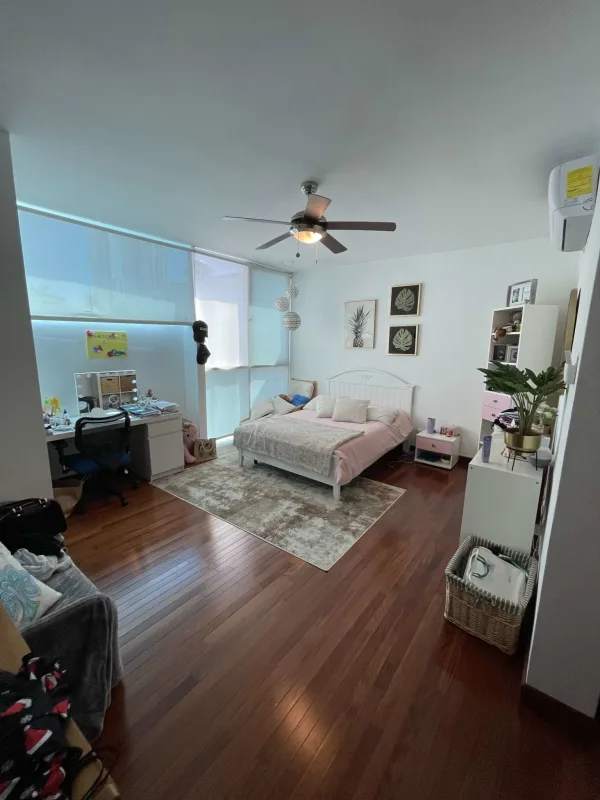 Spacious bedroom featuring wood floors, AC, ceiling fan, bright light in Altos del Golf Panama