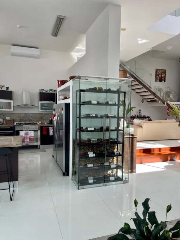 Contemporary kitchen with granite surfaces, wine storage, stainless appliances in Altos del Golf Panama