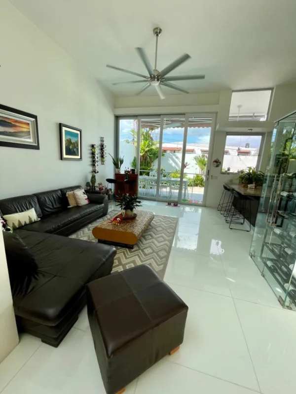 Spacious dining area with high ceilings, tropical design, natural light in Altos del Golf house Panama City