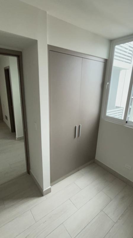 Modern bedroom with built-in wardrobe and large windows PH Bonavista Park Panama City