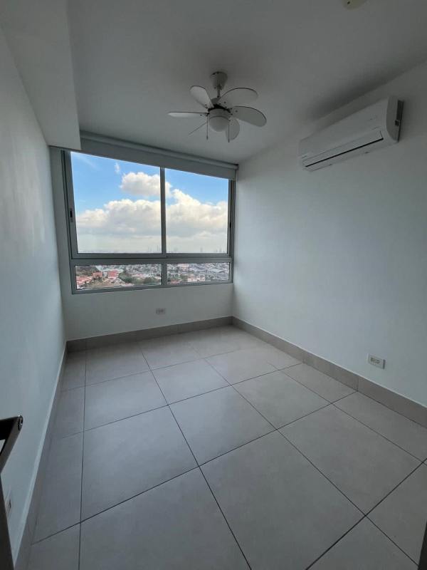 Bright bedroom with ceiling fan, split AC, large window and cityscape view at PH Greenwood Panama