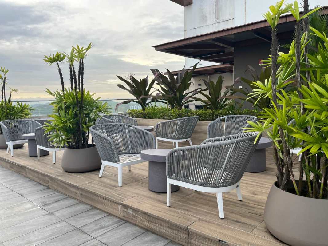 Rooftop pool with skyline view and lounge areas at PH Greenwood Panama City