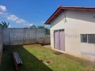 Bright bedroom with tile floors and window in La Arboleda Chorrera Panama