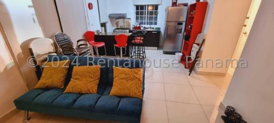 Open living and dining area with tile floors inside San Carlos beachside house