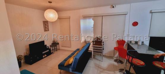 Bright kitchen with breakfast counter tiled floor in San Carlos beach community home