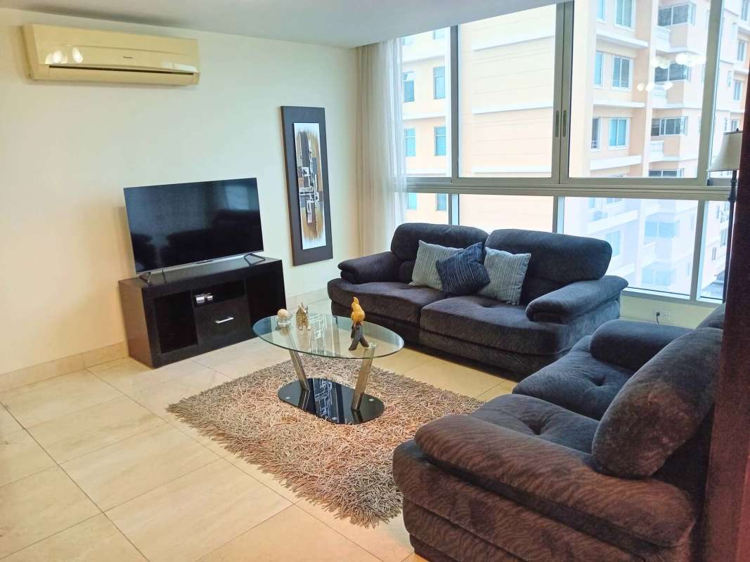 Spacious living room with marble floor, large windows and access to ocean-view balcony in PH Villa del Mar Panama