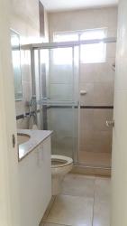 Bathroom with glass shower, wall mirror and modern fixtures Playa Dorada Arraiján Panama