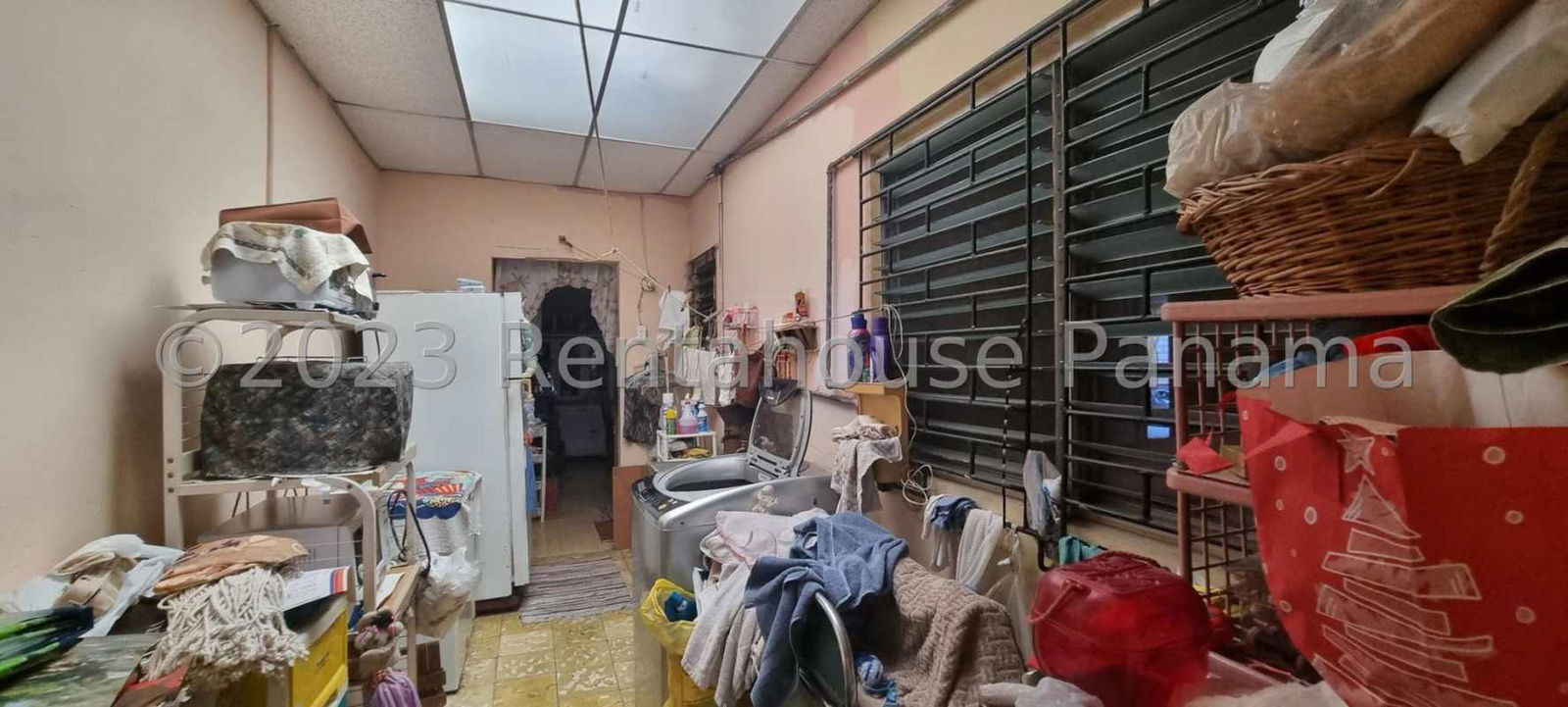 Covered laundry area inside spacious home for sale Juan Díaz Panama