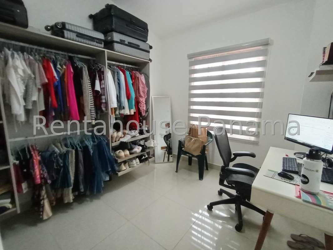 Walk-in closet and workspace combo at Villa Zaita Panama City house for sale