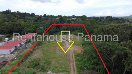 Top view of empty commercial lot outlined in red, marked center, near trees Vista Alegre Panama