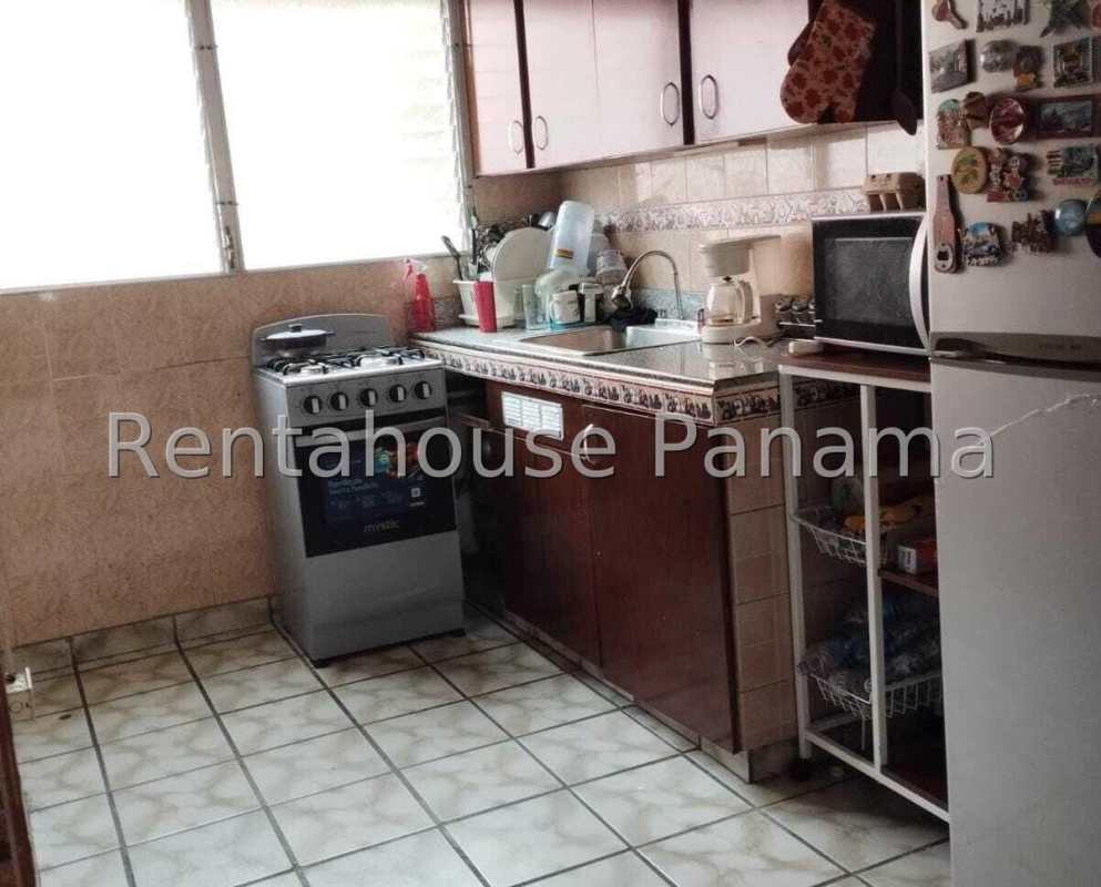 Indoor stairwell with tiled steps, handrails, plants, natural light in PH José Eduardo Lefevre Panama