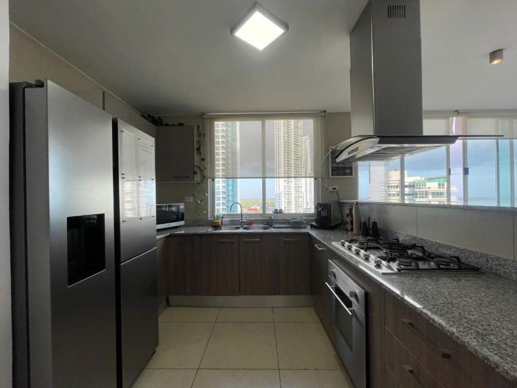 Contemporary kitchen with granite countertops, refrigerator and stove PH Lumiere Costa del Este Panama City