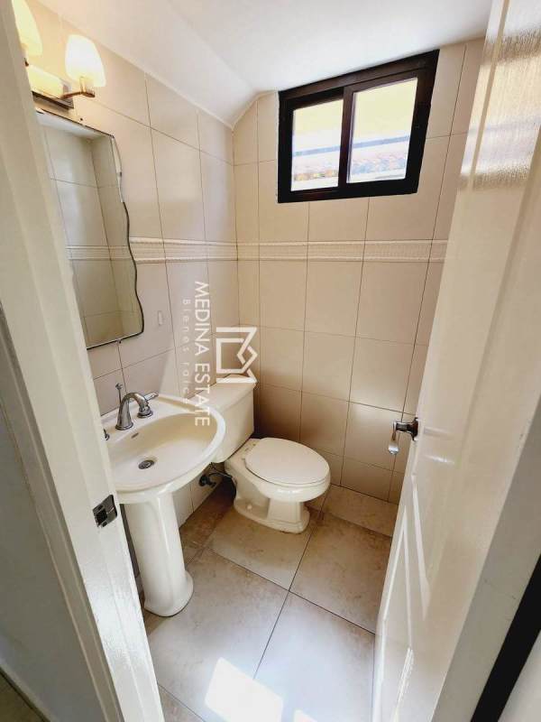 Bathroom with granite countertop, glass shower enclosure, modern tile in Panama house