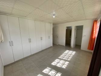 Bedroom with large wardrobe tiled floor Mystic City house Panama