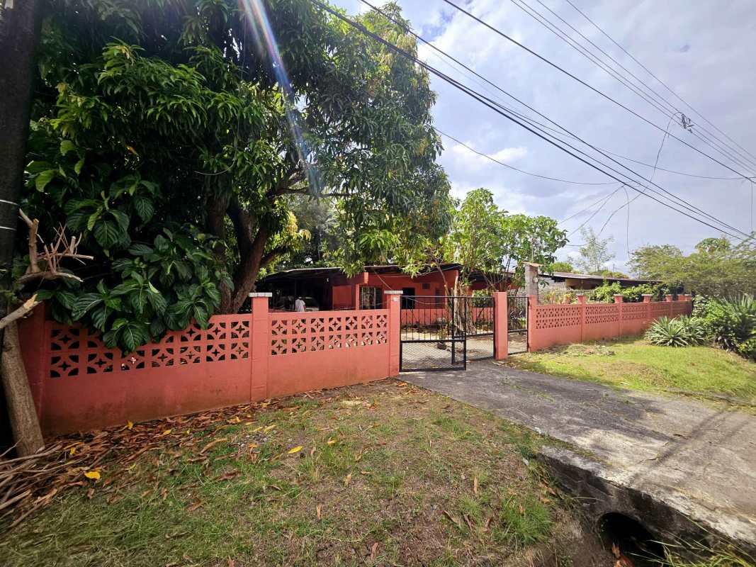 Covered front terrace entry area of large fenced home for sale Ciudad Radial Panama