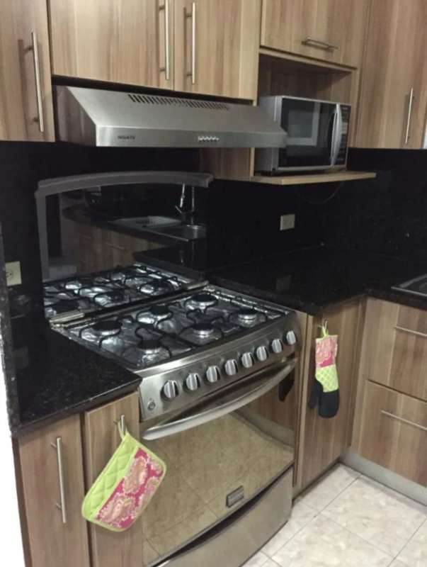 Bedroom with built-in closets, accent wall, modern design in PH Residencial Betania Panama City