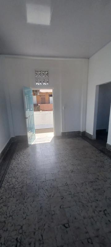 Entrance area with patterned tile floors and blue door in central Panama City Calidonia