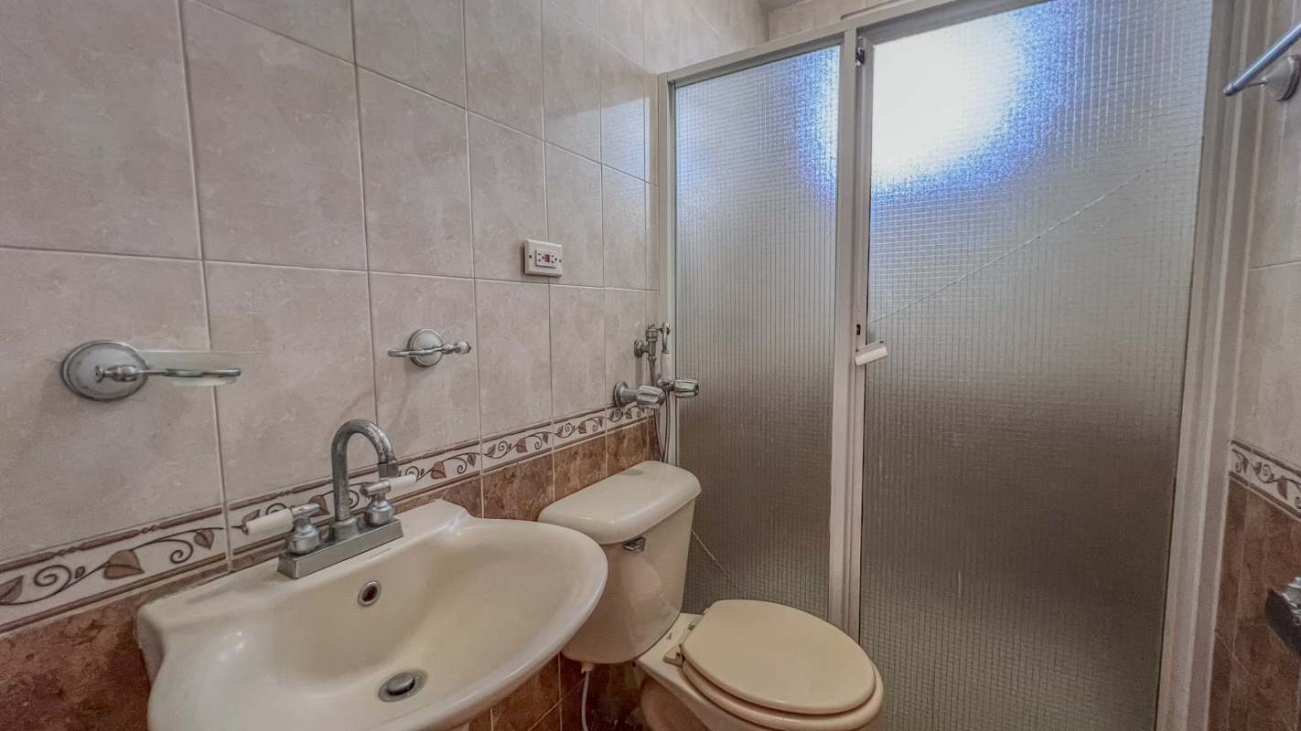 Modern kitchen with black tiles, island with sink, glass blocks Villa Zaita House for Sale