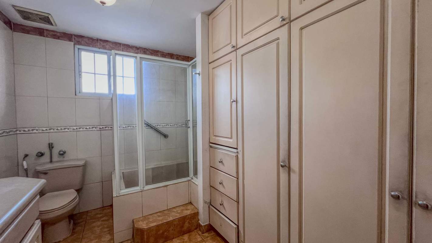 Full bathroom with glass enclosure and cabinetry in Villa Zaita House Panama