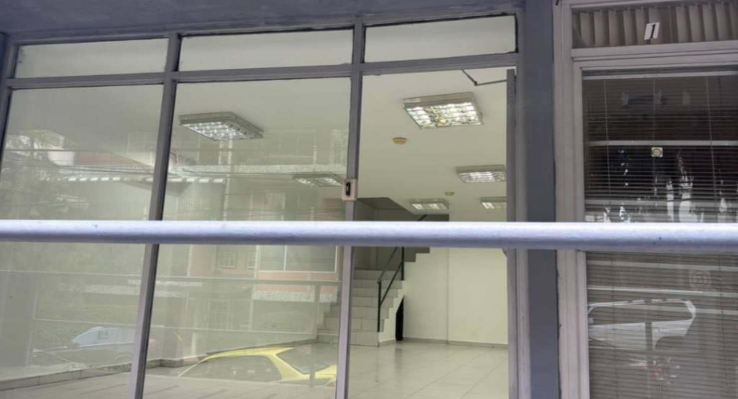 Retail or office space with large glass windows and doors on busy Via Argentina Panama City