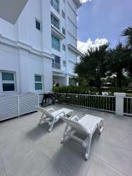 Covered terrace with outdoor dining and garden views at Bijao Beach Resort Panama