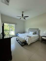 Infinity pool surrounded by tropical gardens in Bijao Beach Condo Panama