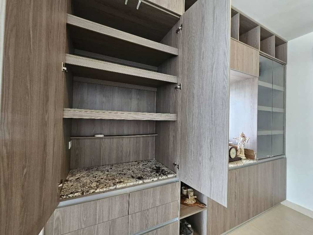 Modern wooden cabinetry pantry or storage with granite surface in PH Rivage Tower Panama