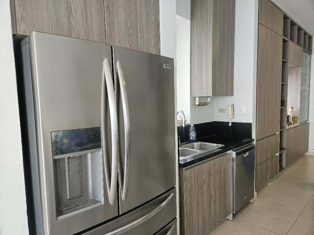 Contemporary kitchen with stainless appliances, double fridge, granite counters at PH Rivage Panama
