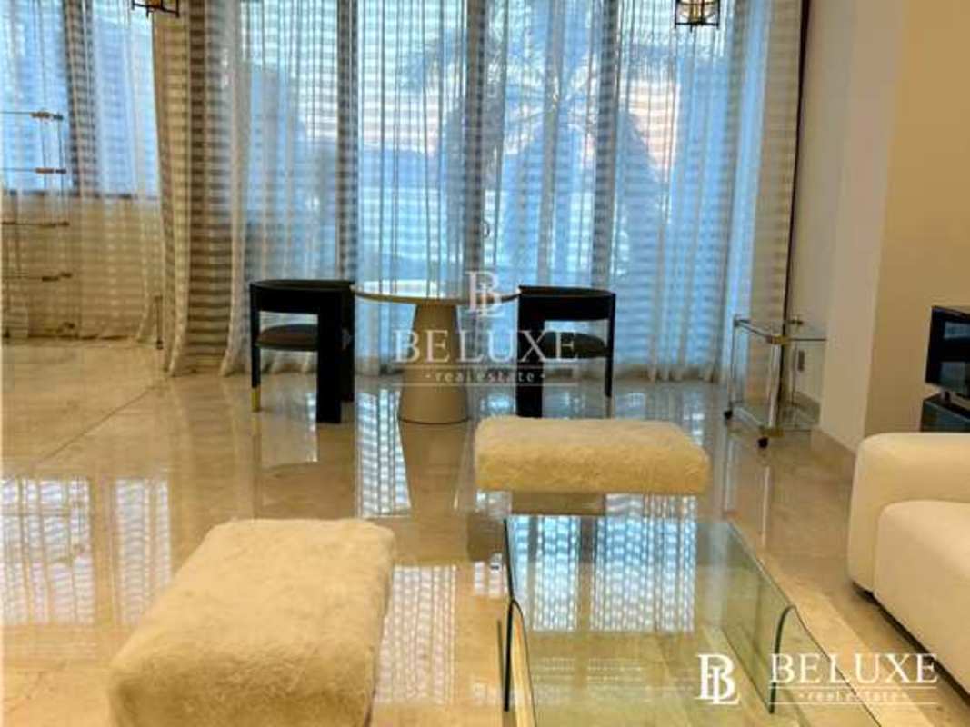 Modern dining area with marble floors panoramic window marina views PH Garden Ocean Reef Panama City