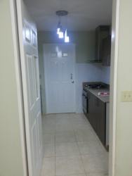 Spacious bedroom with tiled floor and ample natural light in La Arboleda La Chorrera Panama