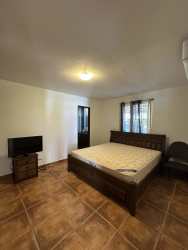 Simple bedroom with tiled floor, window blinds, traditional look Playa Blanca Panama